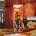 Illuminated 84 Charing Cross Road book nook with a miniature London bookshop and street scene.