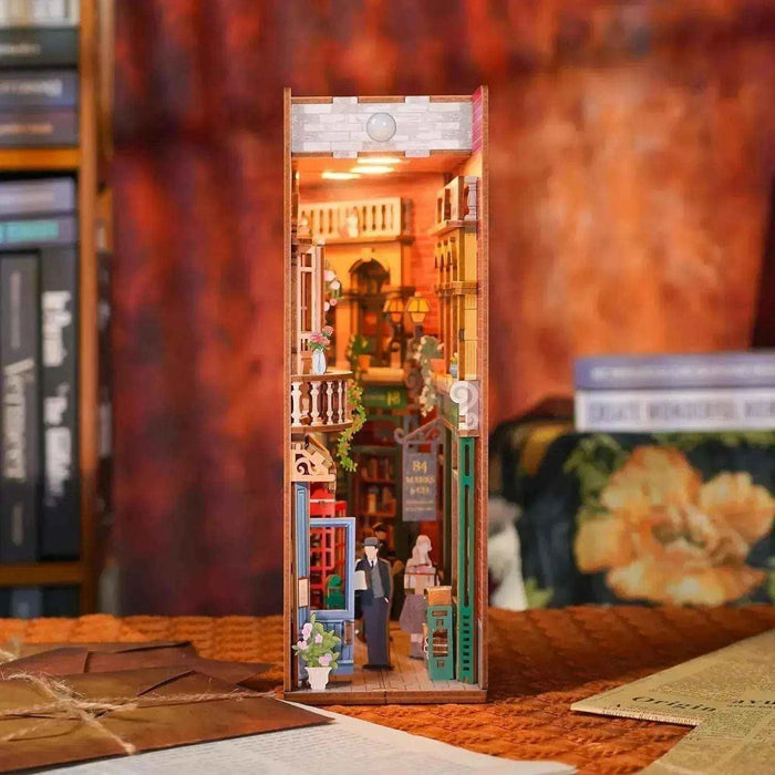 Illuminated 84 Charing Cross Road book nook with a miniature London bookshop and street scene.