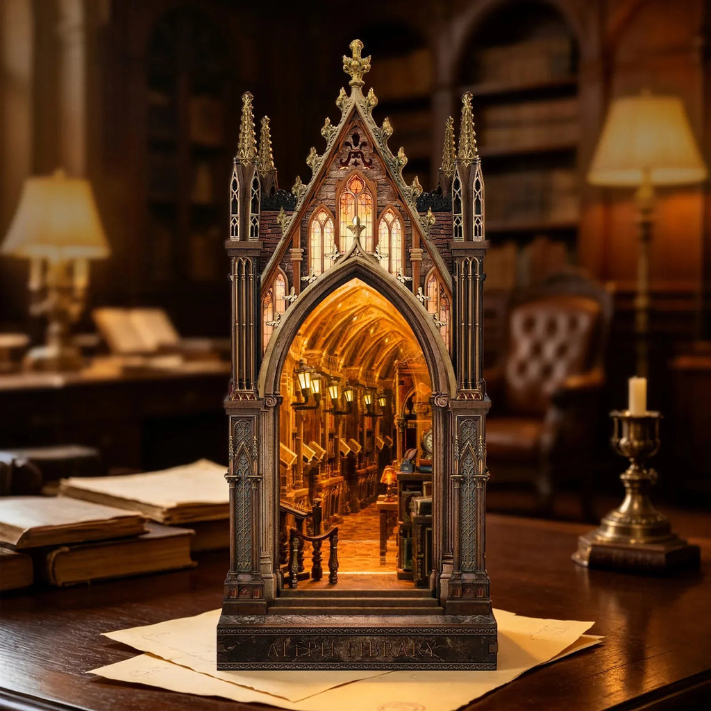 Aleph Library book nook on a desk beside books and a candleholder.