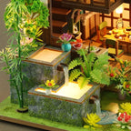 Bamboo Spring Courtyard miniature stream flowing past bamboo and small planted terraces.