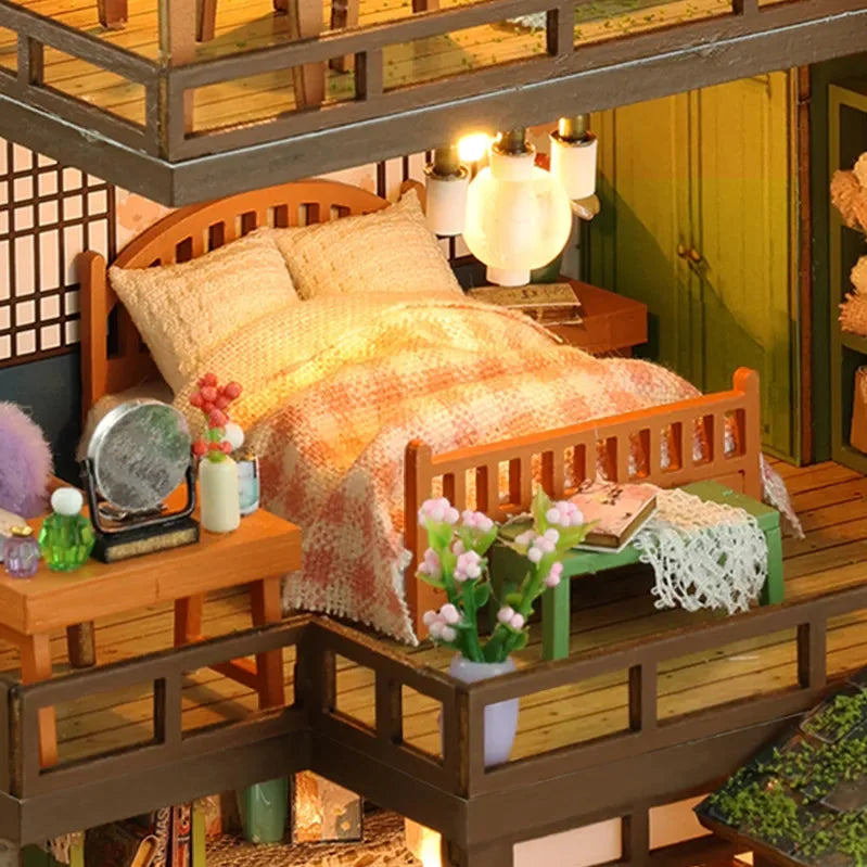 Bamboo Spring Courtyard upper bedroom with a peach-colored quilt and bedside lighting.