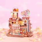 Candy Workshop pink miniature factory with a candy dispenser, striped awnings and a candy sign.