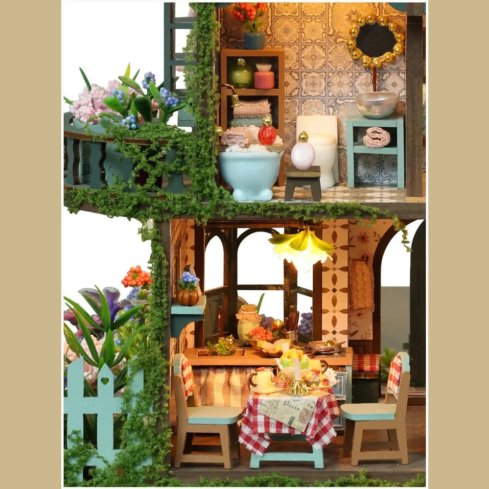 Fairy Garden details showing a miniature bathroom and an outdoor dining table.