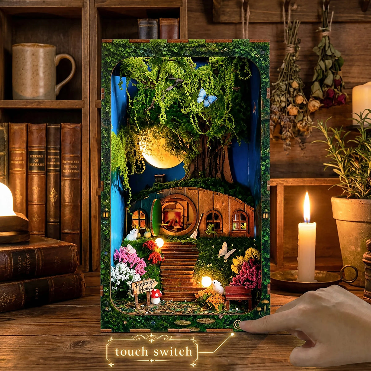Hobbins Hovel displayed on a desk with a finger at the front touch-lighting switch.