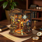 Inchspace Bookstore miniature room on a desk with tiny shelves, books and a curved display base.