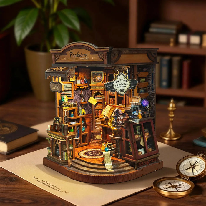 Inchspace Bookstore miniature room on a desk with tiny shelves, books and a curved display base.