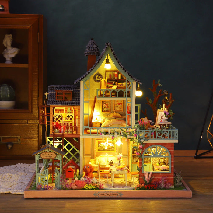 Jungle Secret miniature house with tall open rooms, balconies and warm lights.