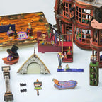 Magic Wonder House miniature counters, props and structural panels arranged for assembly.