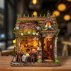 Mocha Diary miniature café with floral trim, an ornate roof and a small outdoor tea table.
