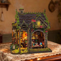 Myriad Realms Club miniature shop with a vine-covered roof and colorful crystal displays.