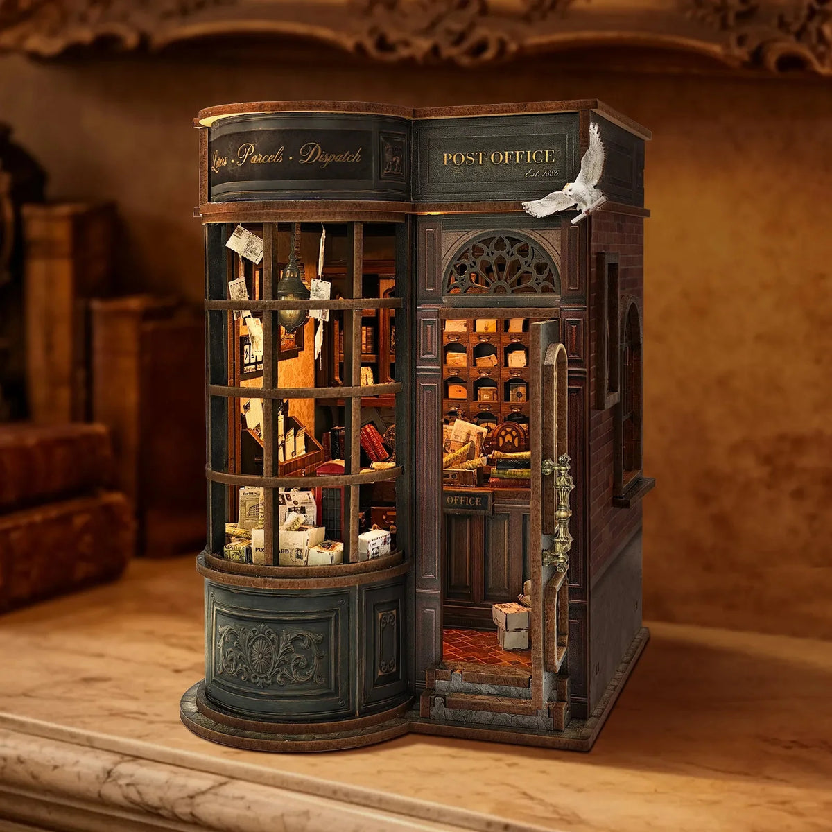 Night Owl Courier book nook with a curved postal-shop window and miniature mail inside.