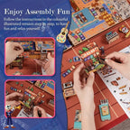 Hands assembling Plaza de los Muertos miniature panels and colorful street decorations.
