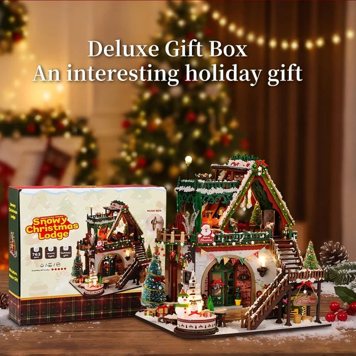 Snowy Christmas Lodge miniature house beside its illustrated kit box.